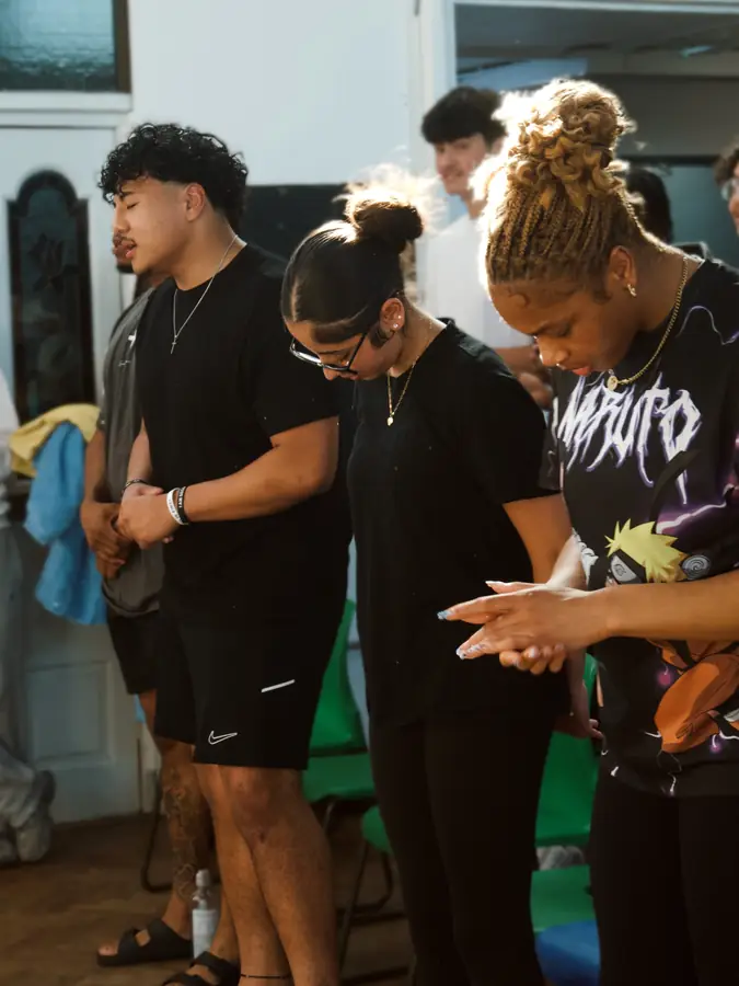 Young people praying together