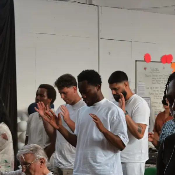 Young people praying with hands together