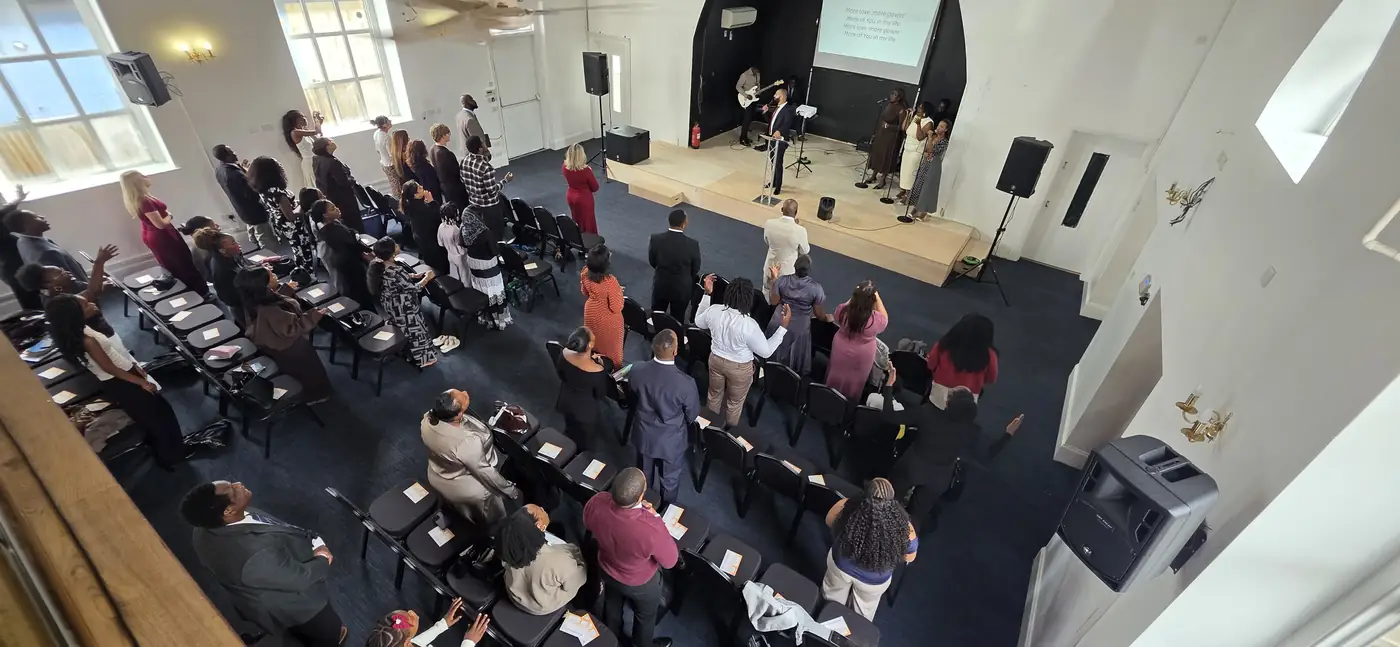 Worshippers gathered in front of the stage in the main hall